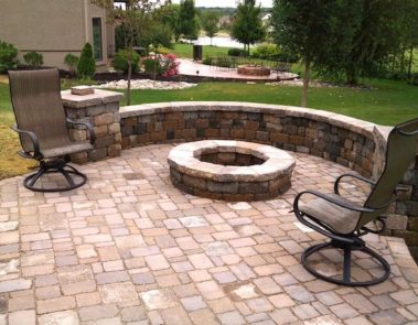 Landscaping In Raymore MO Stone Patio With Fire Pit
